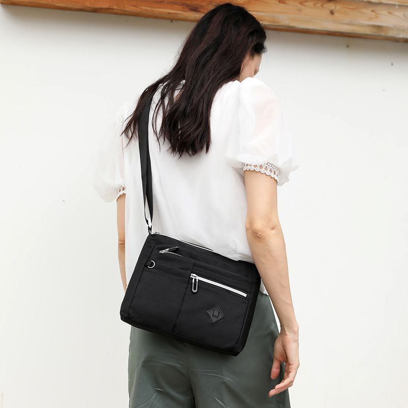 Lightweight Nylon Crossbody Shoulder Bag with Multi Pockets and Adjustable Strap, Light Blue