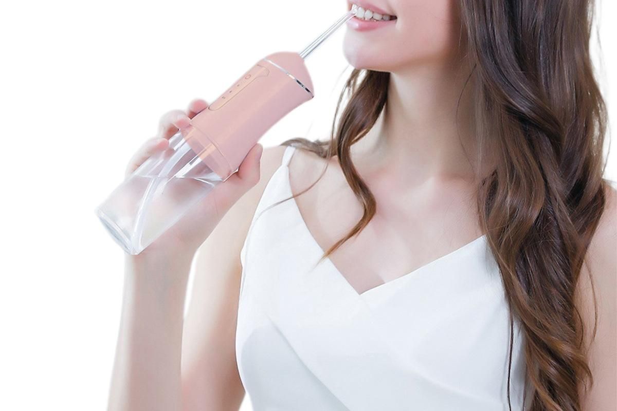 Cordless Portable Electric Water Flosser Teeth Cleaner Floss Irrigator With 4 Jet Tips - Pink